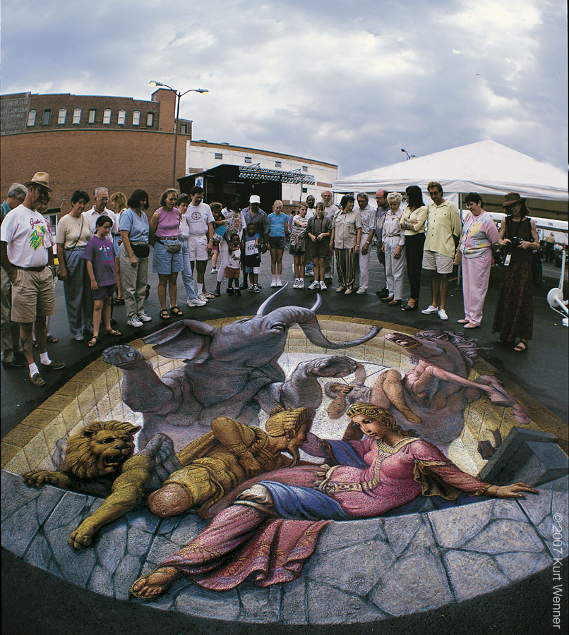 Kurt Wenner là một trong những nghệ sĩ nổi tiếng thế giới trong lĩnh vực vẽ tranh đường phố. Nếu bạn muốn tìm hiểu về những bức tranh đường phố đầy màu sắc và ấn tượng của anh ấy, hãy xem qua bức tranh này. Đảm bảo bạn sẽ \